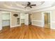 Main bedroom with hardwood floors, tray ceilings, access to ensuite bathroom and walk-in closets at 2420 New Bethel Church Rd, Garner, NC 27529