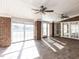 Sunroom featuring brick walls, tile floors, white trim, and abundant natural light at 2420 New Bethel Church Rd, Garner, NC 27529