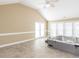 Bright sunroom featuring a hot tub, tile floors, and access to the backyard at 2420 New Bethel Church Rd, Garner, NC 27529