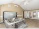 Bright sunroom featuring a hot tub, tile floors, and access to the backyard at 2420 New Bethel Church Rd, Garner, NC 27529