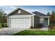 Attractive single-story home with a two-car garage and manicured landscaping at 2644 Pivot Ridge Dr, Raleigh, NC 27616