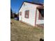 Angled side view of home with white siding and red shutters at 305 N State St, Raleigh, NC 27601