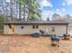 Rear exterior of home with siding, satellite dish, and grassy yard at 372 Pocomoke Rd, Franklinton, NC 27525