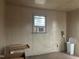 Bedroom with paneling, window AC unit, and neutral tones at 405 N Wilson Ave, Dunn, NC 28334