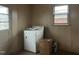 Laundry room with washer, dryer, and window at 405 N Wilson Ave, Dunn, NC 28334