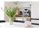 Bright kitchen area with sleek appliances and stylish shelving ideal for coffee enthusiasts at 405 Reynolds N Ave, Durham, NC 27707