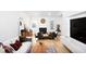 Airy living room with white walls, natural light, modern fireplace and stylish decor at 405 Reynolds N Ave, Durham, NC 27707