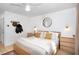 Spacious main bedroom with ceiling fan, stylish decor, and light hardwood floors at 405 Reynolds N Ave, Durham, NC 27707