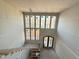 Entryway features a wall of windows for natural light, stairs, and a wood door at 436 Oakland Dr, Raleigh, NC 27609
