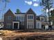 Stunning brick home with large windows, a modern aesthetic, and beautiful architectural details at 436 Oakland Dr, Raleigh, NC 27609