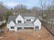 Striking new construction home with a light gray roof and white siding, ready for its final touches at 436 Oakland Dr, Raleigh, NC 27609