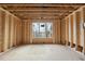 Bright, new construction interior room featuring a window and unfinished floors at 436 Oakland Dr, Raleigh, NC 27609