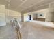 Expansive living room featuring open layout, smooth concrete floor, and natural light for customization at 436 Oakland Dr, Raleigh, NC 27609