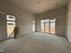 Spacious living room featuring large windows, providing ample natural light, and ready for personalization at 436 Oakland Dr, Raleigh, NC 27609
