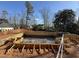 In-ground pool under construction showing the framing and rebar in a landscaped backyard at 436 Oakland Dr, Raleigh, NC 27609
