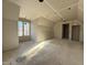 Unfinished room boasts a large window with natural light and a framed opening for a door at 436 Oakland Dr, Raleigh, NC 27609
