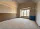 Unfinished room with vaulted ceiling and a large window that fills the space with natural light at 436 Oakland Dr, Raleigh, NC 27609