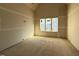 New room with one window, taped walls, and a vaulted ceiling at 436 Oakland Dr, Raleigh, NC 27609