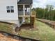 View of the backyard featuring a screened porch and wooden deck at 4404 Emeline Way # 35, Fuquay Varina, NC 27526
