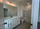 Bright bathroom featuring dual vanities, shower and bathtub at 4404 Emeline Way # 35, Fuquay Varina, NC 27526