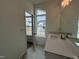 Modern bathroom featuring granite countertops, stainless faucet, and open door at 4404 Emeline Way # 35, Fuquay Varina, NC 27526