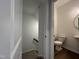 Cozy bathroom features a toilet, sink, and hardwood floors, offering essential functionality in a compact space at 4404 Emeline Way # 35, Fuquay Varina, NC 27526