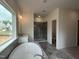 Elegant primary bathroom showcasing a soaking tub, glass-enclosed shower, and modern fixtures at 4404 Emeline Way # 35, Fuquay Varina, NC 27526