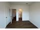 Spacious bedroom featuring walk-in closet, ensuite bathroom, modern floors, and neutral paint at 4404 Emeline Way # 35, Fuquay Varina, NC 27526