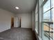 Bedroom featuring neutral walls, carpeted floor, and large windows at 4404 Emeline Way # 35, Fuquay Varina, NC 27526
