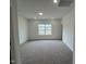 Bedroom featuring plush carpeting, recessed lighting, fresh white paint, and bright, natural light at 4404 Emeline Way # 35, Fuquay Varina, NC 27526
