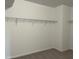 Walk-in closet includes wire shelving and neutral carpeted floors, providing practical storage space at 4404 Emeline Way # 35, Fuquay Varina, NC 27526