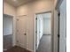 Hallway with three open doors to other rooms at 4404 Emeline Way # 35, Fuquay Varina, NC 27526
