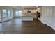 Open floor plan features a kitchen with an island, dining area, hardwood floors, and lots of natural light at 4404 Emeline Way # 35, Fuquay Varina, NC 27526