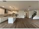 Open floor plan features a kitchen with an island, staircase, hardwood floors, and lots of natural light at 4404 Emeline Way # 35, Fuquay Varina, NC 27526