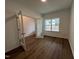Bright office space with modern flooring, ample natural light from a large window and French doors at 4404 Emeline Way # 35, Fuquay Varina, NC 27526