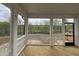 Covered porch with a view of trees features wood flooring and white railings, offering a relaxing outdoor retreat at 4404 Emeline Way # 35, Fuquay Varina, NC 27526