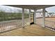Covered porch features wood flooring and white railings, providing a tranquil outdoor space at 4404 Emeline Way # 35, Fuquay Varina, NC 27526