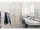 Modern bathroom with dual sinks, shower, and tiled floor, creating a spa-like atmosphere at 4511 Crab Creek Dr # 201, Raleigh, NC 27612