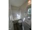 Bathroom features shower-tub combo with white tiling and vanity at 5520 Neuse View Dr, Raleigh, NC 27610