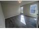 Spacious bedroom with wood-look flooring and lots of natural light at 5520 Neuse View Dr, Raleigh, NC 27610