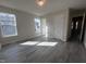 Large bedroom features wood-look flooring and lots of natural light at 5520 Neuse View Dr, Raleigh, NC 27610