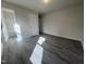 Bedroom leads into bath with wood-look flooring and lots of natural light at 5520 Neuse View Dr, Raleigh, NC 27610