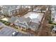 Aerial view of the community pool surrounded by residential buildings with a parking area in view at 5618 Wade Park Blvd, Raleigh, NC 27607