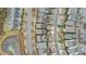 Aerial view showcasing neighborhood layout, tree coverage, and nearby pond at 5618 Wade Park Blvd, Raleigh, NC 27607