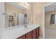 Bathroom featuring a wide mirror, a single sink vanity with storage, and a view to the toilet and shower at 5618 Wade Park Blvd, Raleigh, NC 27607