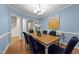 Elegant dining room featuring hardwood floors, stylish decor, and ample natural light at 5618 Wade Park Blvd, Raleigh, NC 27607