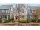 Desirable home boasts a neatly landscaped yard, mature tree, and a welcoming entrance at 5618 Wade Park Blvd, Raleigh, NC 27607