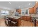 Modern kitchen with stainless steel appliances, granite countertops, and a breakfast bar at 5618 Wade Park Blvd, Raleigh, NC 27607