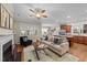 Inviting living area with a fireplace, hardwood floors, and a view of the adjacent kitchen at 5618 Wade Park Blvd, Raleigh, NC 27607
