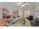 Open-concept living room flowing into a kitchen with ample seating and natural light at 5618 Wade Park Blvd, Raleigh, NC 27607
